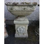 A Stone Garden Jardiniere, Of Campagna style, raised on a square base, decorated with floral panels,