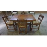 An Ercol Pull Out Dining Table with Four Chairs, Table 75cm high, 115cm long, 80cm wide, the table
