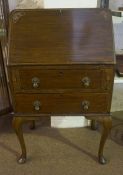 A Ladies Mahogany Writing Bureau, With fall front above two drawers, raised on pad foot, 100cm high,