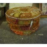 A Middle Eastern Pouffe, 29cm high, 51cm wide