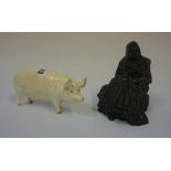 A Beswick Figure of a Pig, 7cm high, also with a carved coal figure of a female, (2)