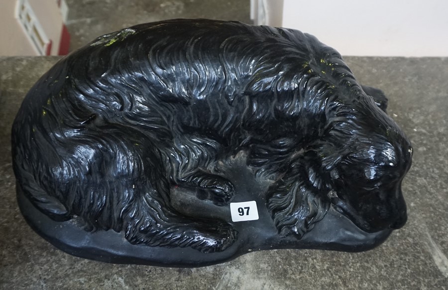 A Large Black Painted Companion Figure of a Spaniel Dog, stamped H.G.C, 45cm wide