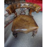 A Victorian Mahogany Library Type Chair, Upholstered in tan leather, Having a serpentine shaped