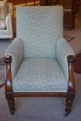 A Victorian Mahogany Armchair, Upholstered in later fabric, raised on turned legs with brass