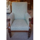 A Victorian Mahogany Armchair, Upholstered in later fabric, raised on turned legs with brass