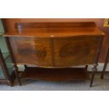 A Victorian Style Mahogany Serpentine Side Cupboard, 20th century, with two doors above under