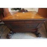 A Regency Mahogany Wine Cooler, circa early 19th century, Of sarcophagus form, Having a hinged top