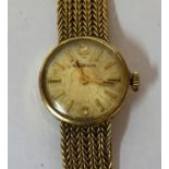 A 9ct Gold Ladies Swiss Made Wristwatch by Marvin, With baton numerals to the dial, on a gold mesh