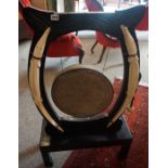 An Anglo Indian Style Ebonised Dinner Gong, circa early 20th century, Having a hammered gong,