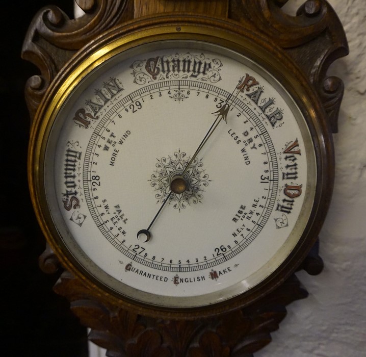 An Edwardian Carved Oak Wheel Barometer, Having a thermometer gauge above enamel dial, 88cm high - Image 2 of 3