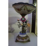 A Victorian Style Continental Stemmed Bowl on Stand, Encrusted with flowers, having brass mounts,