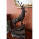 After Mogniez, A Pair of Large Bronze Figures of Stags, 20th century, Raised on a veined marble