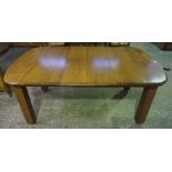 A Mahogany Extending Dining Table, circa early 20th century, Having two additional leaves, raised on