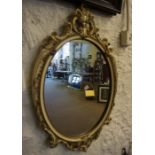 A Pair of Painted Wall Mirrors, Of oval form, 72cm high, 46cm wide, (2)