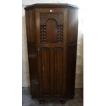 A Jacobean Style Oak Hall Wardrobe, Having a carved door, 186cm high, 110cm wide