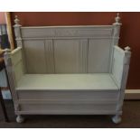 A French Painted Oak Hall Settle, Having a hinged seat, 135cm high, 135cm wide, 50cm deep