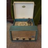 A Dansette "Conquest Auto" Record Player, circa 1960s, Having a Monarch turntable, in a teal and