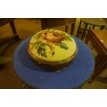 A Victorian Walnut Circular Footstool, Having a needlepoint top, 33cm diameter