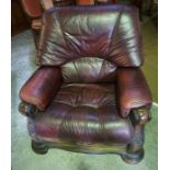 An Oak Framed Two Piece Leather Suite, Comprising of a two seater maroon leather sofa, with matching