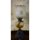 A Vintage Oil Lamp, Having a glass reservoir, funnel and frilly shade, 60cm high