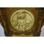 A Composition Relief Moulded Plaque, 20th century, Decorated with Putti style children, 17cm