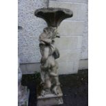 A Painted Stone Garden Plant Stand, Modelled as Putti style children, 95cm high