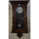 A Mahogany Cased Vienna Wall Clock, Having a twin train dial, 84cm high