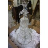 A Bohemian Style Crystal Chandelier, Of large form, Having a crystal centrepiece above twelve