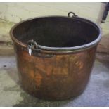 A Large Copper Cauldron, circa 19th century, Of cylindrical form, Having an iron handle, 63cm