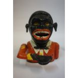 Two Blackamoor Novelty Metal Coin Banks, 14cm, 16cm high, also with a novelty Transvaal coin