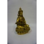 A Thai Brass Figure of a Buddha, 20th century, In a seated pose, 33cm high