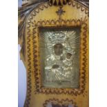 A Russian Icon, Depicting portrait masks on a silvered backing, inscribed to base, (Pod Twojh