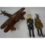 A Wooden Toy Model of a WWI Fighter Plane, 51cm long, also with a pair of carved wood hangers,