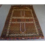 An Afghan Rug, Hand knotted, Decorated with allover multicoloured geometric motifs on a brown