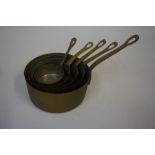 A Large Quantity of Copper Brass Handled Pans, Jelly Moulds, Wine Funnels, circa 19th century and