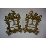 A Pair of French Gilt Metal Photo Frames, circa late 19th / early 20th century, Surmounted by a