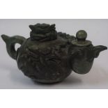 A Chinese Jadeite Tea Pot, circa 19th century, Carved with a dragon to finial and body, 11cm high