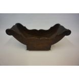 A Regency Mahogany Cheese Coaster, circa 1815, Of boat shape, raised on brass castors, lacking