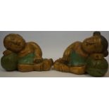 A Pair of Oriental Carved Wood Figures, Modelled as sleeping children resting on pillows, 26cm high,