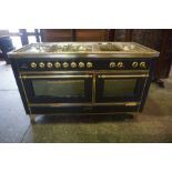 A Large Steel and Brass Gas and Electric Cooker Range by Majestic, (sold as seen), 92cm high,