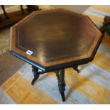 A Victorian Ebonised and Amboyna Octagonal Table, Aesthetic period, Having a label to the