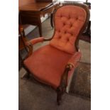 A Victorian Walnut Parlour Armchair, Upholstered in later pink button back velour, raised on