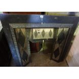 A Victorian Style Cast Iron and Mirrored Fire Insert, Having raised floral decoration, 98cm high,