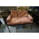 A Converted Iron and Brass Sofa Bed, circa early 20th century, Having a later seat and cushions