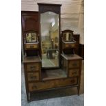 A Late Victorian Walnut Dressing Table, Having a full length mirror to the centre, flanked with