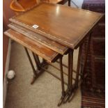 A Mahogany Nest of Three Tables, Having three graduated tables, 67cm high, 49cm wide