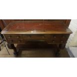 A Victorian Stained Walnut Desk, Having a later tooled leather skiver to the top, above a drawer,