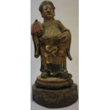 A Chinese Painted Carved Wood Mandarin Figure, circa late 18th / early 19th century, 44cm high