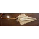 An Edwardian Parasol, Having a silver mount to the handle, 93cm long