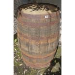 A Large Wooden and Metal Bound Barrel for Bourbon, 92cm high, 55cm diameter